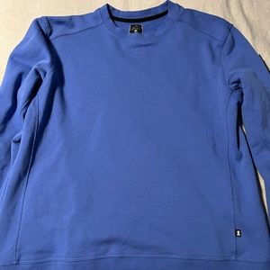 On crewneck sweatshirt size Medium.  Runs a bit small.  Only worn once!